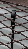 Detail of egress window well grate locks, showcasing the secure locking mechanism for enhanced safety.